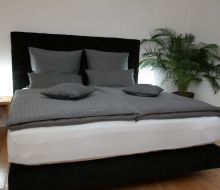 Bett im Zimmer in Pension Franzbäcker in Warburg